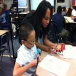 Ms Caston helps her students