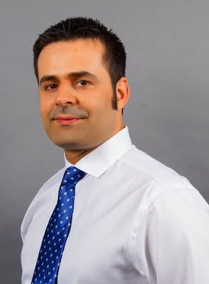 Dr. Davoudi in a button up shirt and tie.