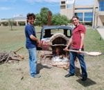 students using homemade pizza oven