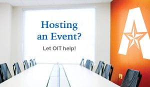 Hosting an event at U T A?  Let O I T help.  A brightly lit conference room with the UTA logo painted on an orange wall.